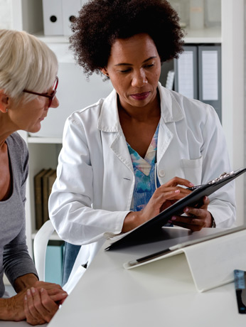 Beverly-Hills-ear,-nose,-and-throat-doctor-discussing-exam-results-with-a-female-patient Beverly-Hills-ear,-nose,-and-throat-doctor-discussing-exam-results-with-a-female-patient