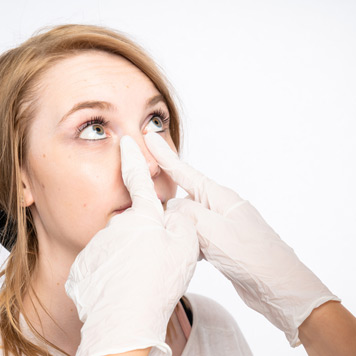 Female-doctor-examining-a-female-patient’s-nose-before-septorhinoplasty Female-doctor-examining-a-female-patient’s-nose-before-septorhinoplasty