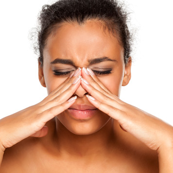 Female-touching-her-nose-and-needing-endoscopic-sinus-surgery Female-touching-her-nose-and-needing-endoscopic-sinus-surgery