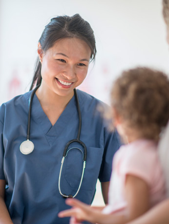 Nurse-discussing-adenoidectomy-procedure-with-little-girl-and-her-mother-at-the-doctor's-office