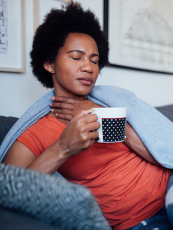Woman-holding-her-throat-in-pain-and-needing-to-visit-the-best-ENT-Doctor-in-Beverly-Hills Woman-holding-her-throat-in-pain-and-needing-to-visit-the-best-ENT-Doctor-in-Beverly-Hills